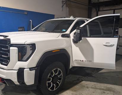 Car receiving automotive window tinting