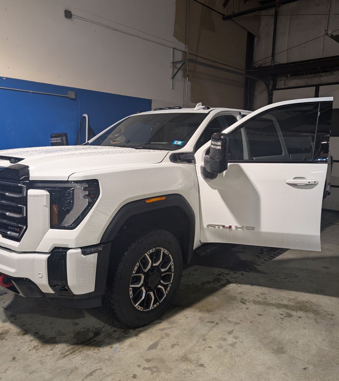 Vehicle receiving automotive window tinting from NH Tint