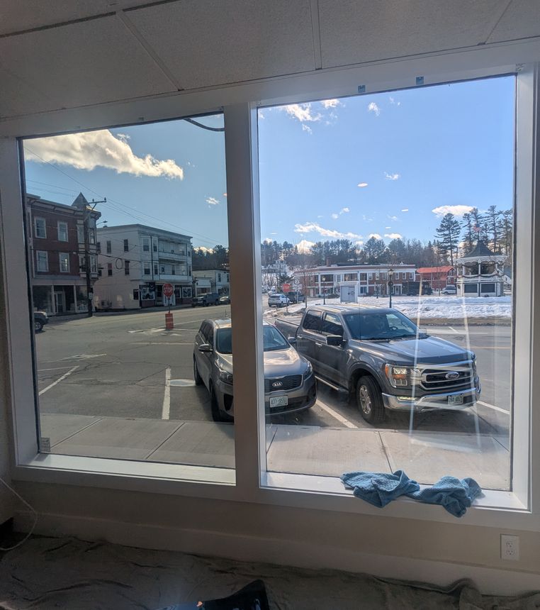 Commercial window cleaning in progress at a business property