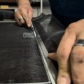 Rescreening a damaged window screen with fresh mesh and new spline.